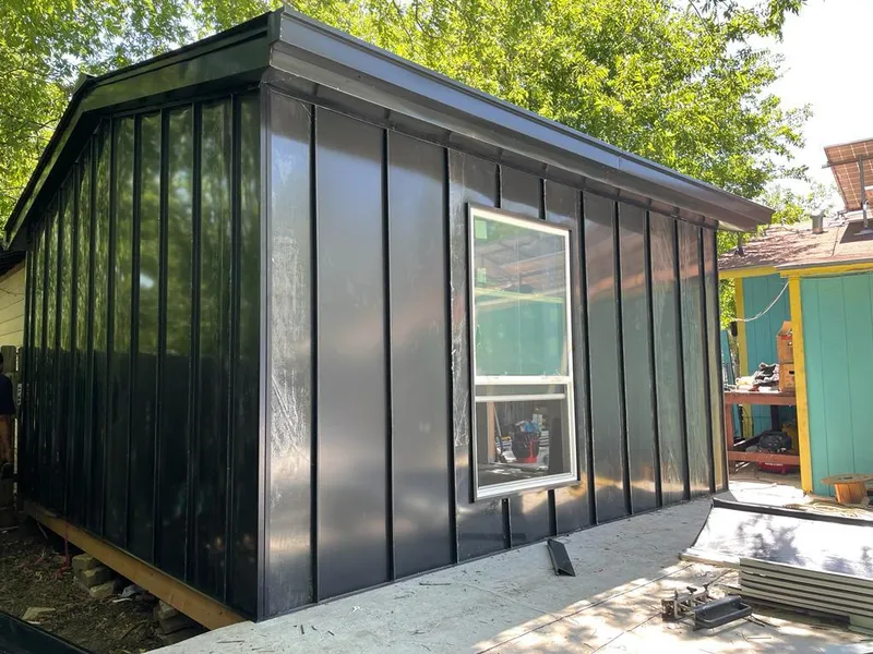 Black standing seam metal wall panels for Roof Inspection in Holdrege