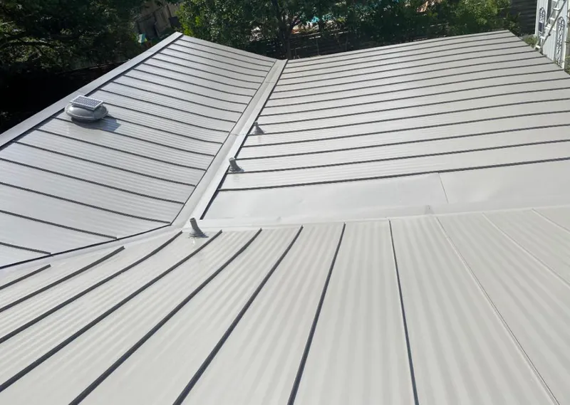 Solar attic fan installed on a metal roof for Roof Ventilation in Holdrege